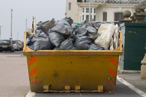 Workers handling commercial rubbish and sorted containers